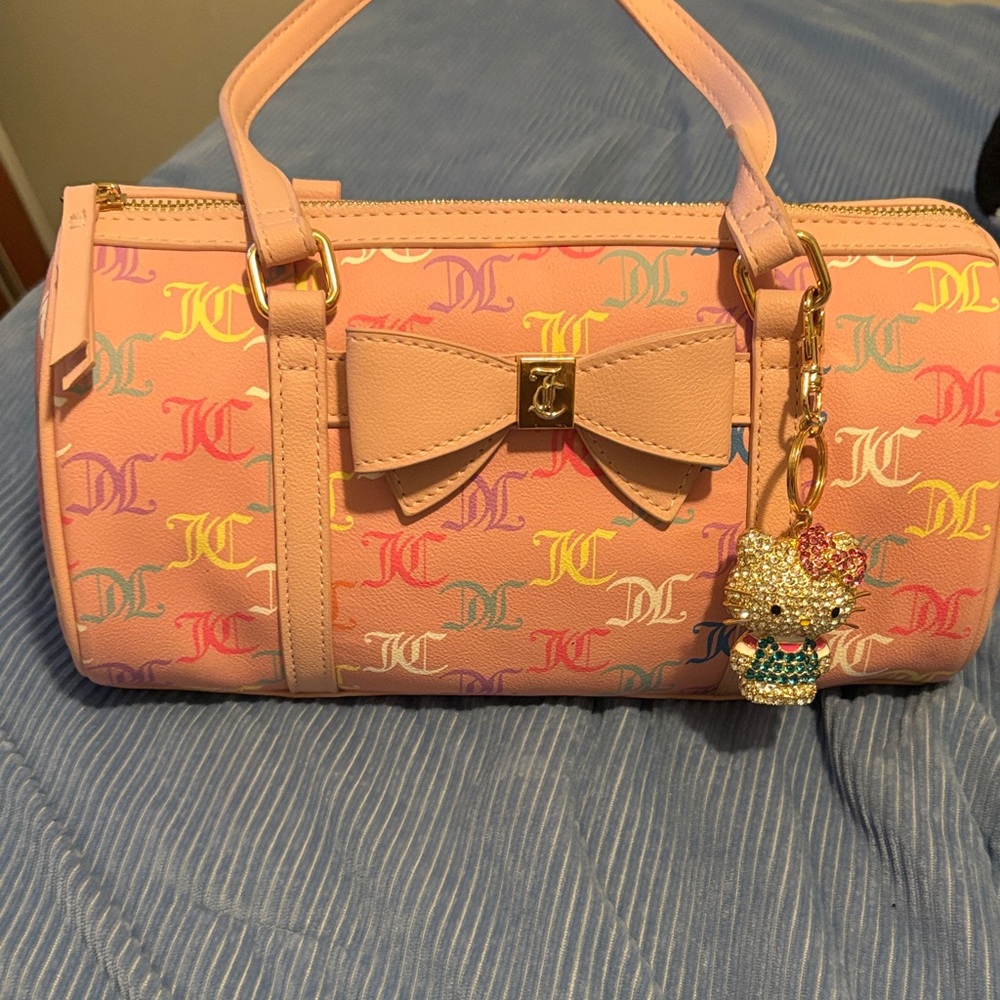 Pink Juicy Couture barrel bag with multicolored JC logo